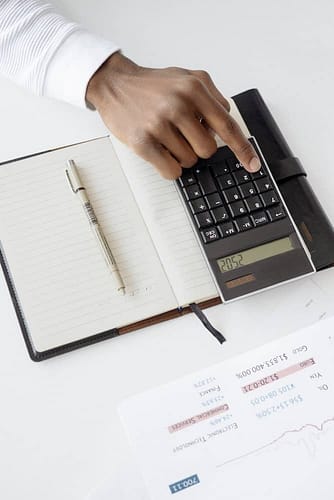 person works with calculator